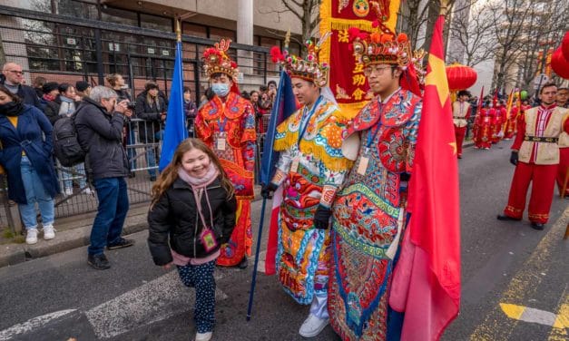 Flag bearers in embroidered costumes