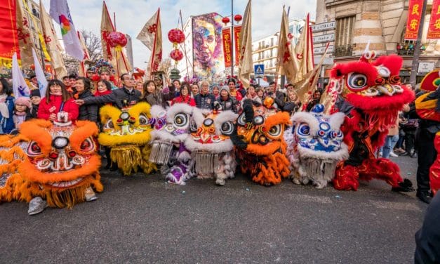 Row of lions in front of the crowd