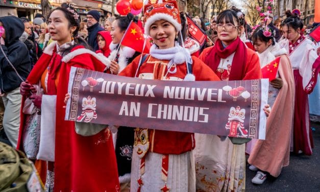 Young women in Hanfu costumes carrying a message
